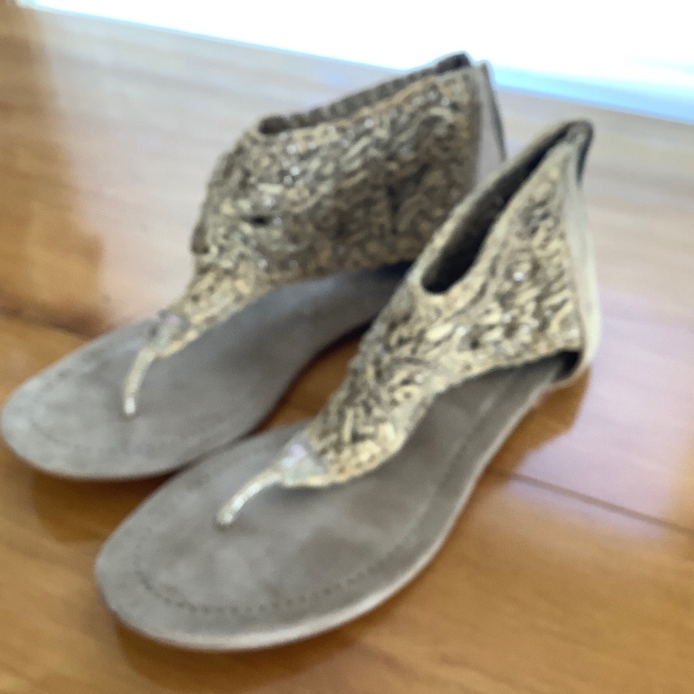 All leather tan sandals with soft woven leather uppers, zippered back.